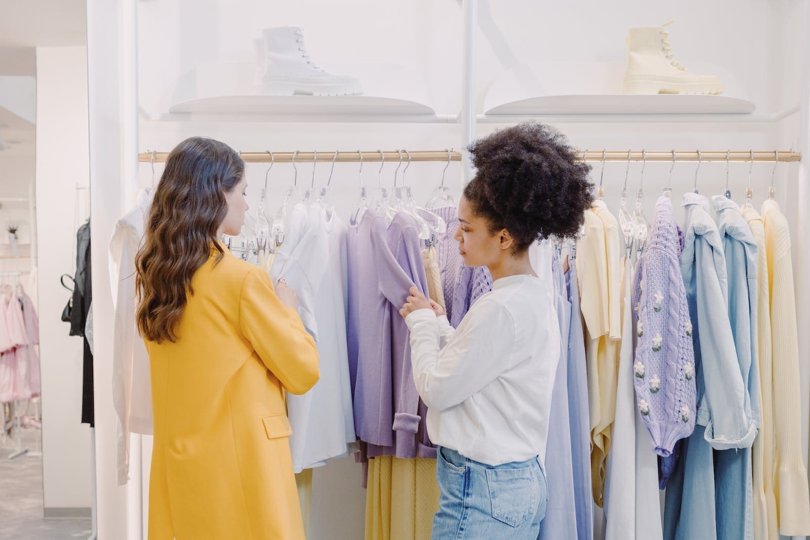A Woman Looking at Clothes with a Personal Stylist